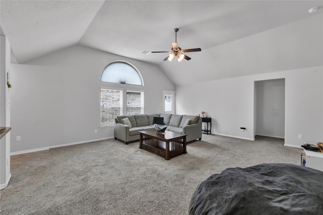 living room featuring ceiling fan, light colored carpet, and vaulted ceiling