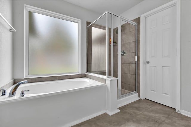 bathroom with separate shower and tub