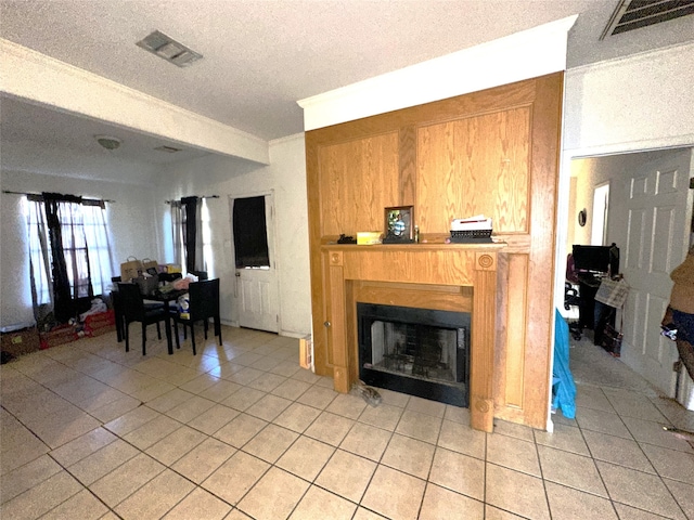 tiled living room with a textured ceiling