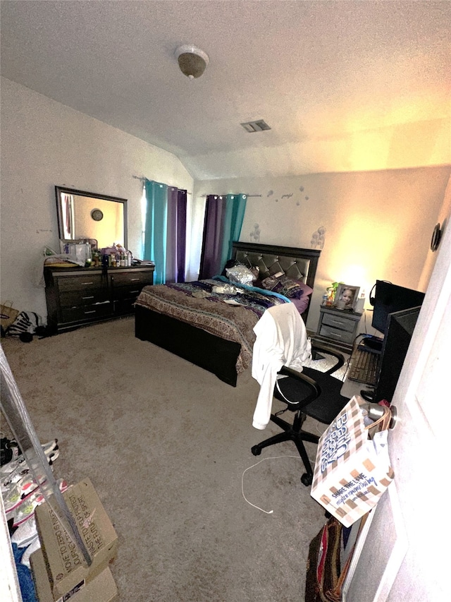 carpeted bedroom with a textured ceiling