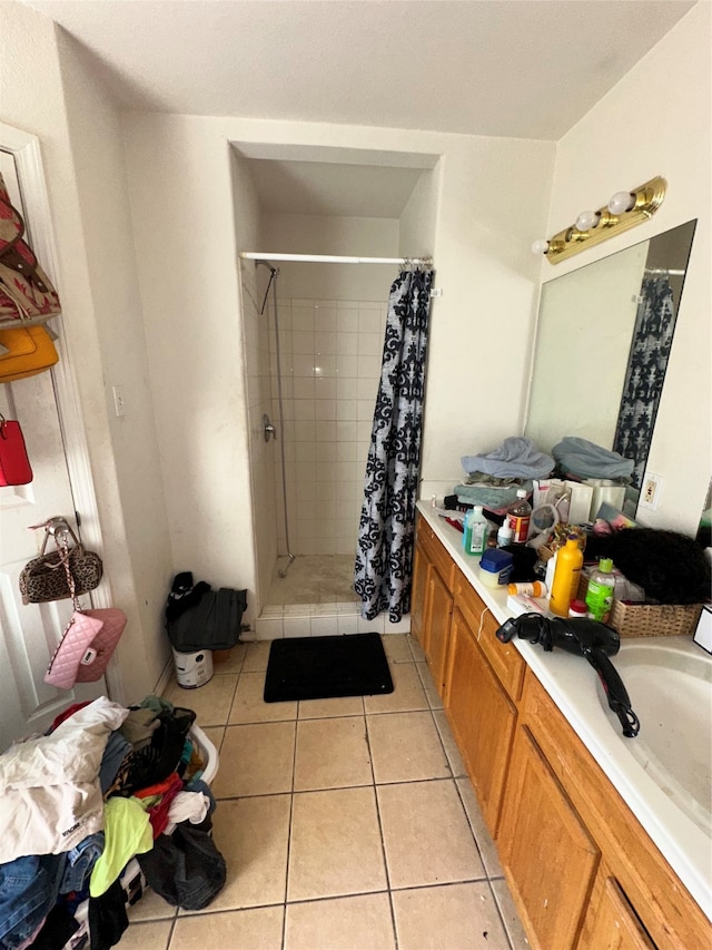 bathroom with vanity, tile patterned floors, and curtained shower