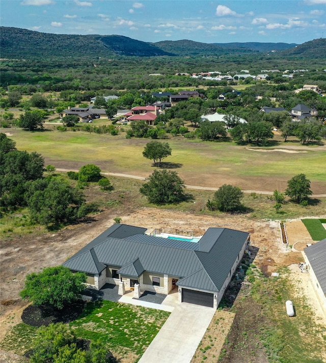 birds eye view of property featuring a mountain view