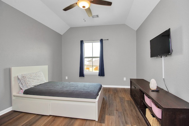 bedroom featuring dark hardwood / wood-style floors, ceiling fan, and lofted ceiling