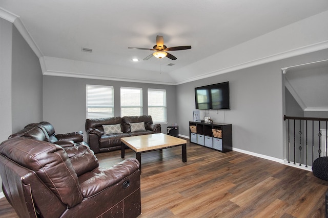 living room featuring lofted ceiling, hardwood / wood-style flooring, ceiling fan, and crown molding