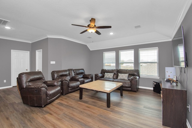 living room with hardwood / wood-style floors, ceiling fan, lofted ceiling, and crown molding