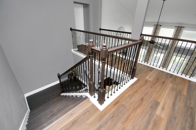 stairs featuring hardwood / wood-style flooring