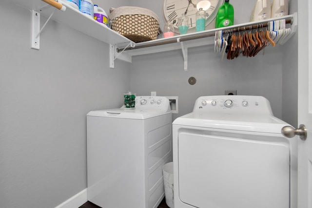 clothes washing area featuring washer and clothes dryer