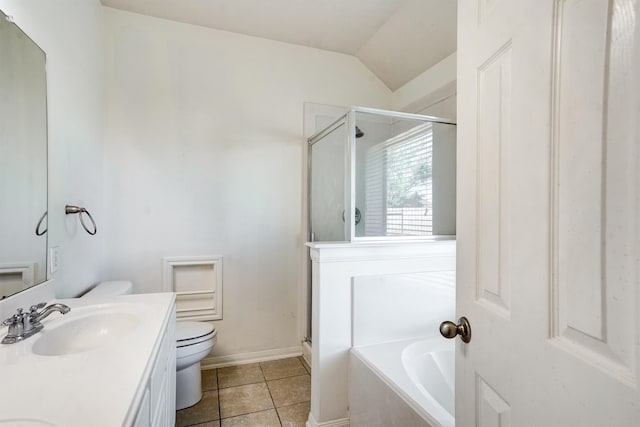 full bathroom with tile patterned floors, separate shower and tub, vaulted ceiling, toilet, and vanity