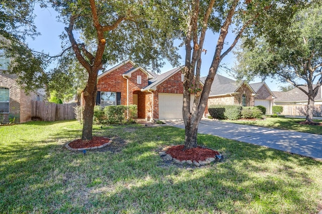 view of front of house with a front yard and a garage