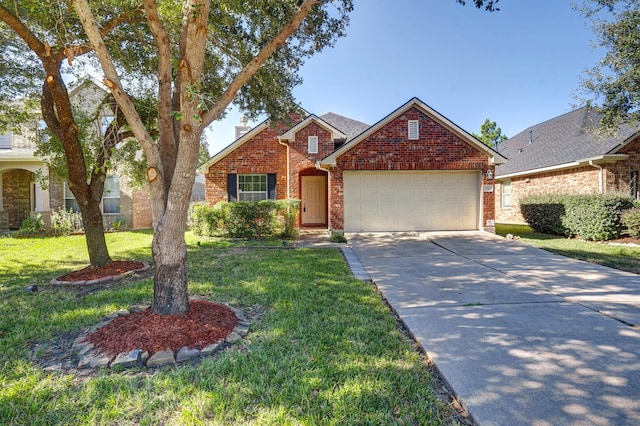 view of front of house featuring a front lawn and a garage