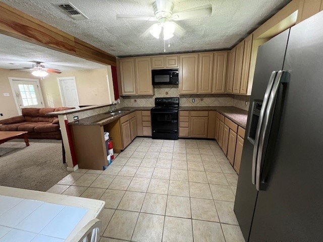 kitchen featuring backsplash, black appliances, ceiling fan, light tile patterned floors, and a textured ceiling