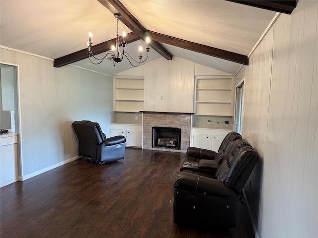 living room with a textured ceiling, wooden walls, a notable chandelier, vaulted ceiling with beams, and dark hardwood / wood-style floors