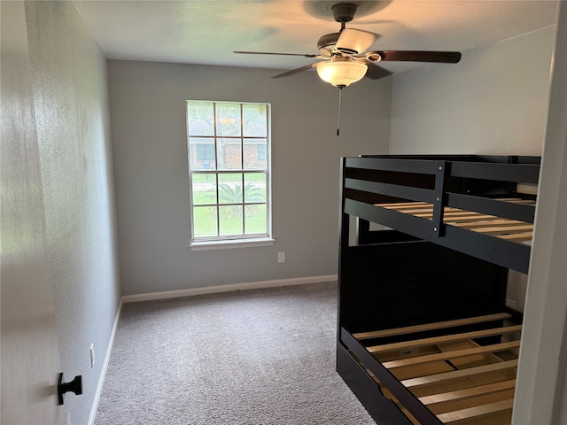 bedroom featuring ceiling fan and carpet floors