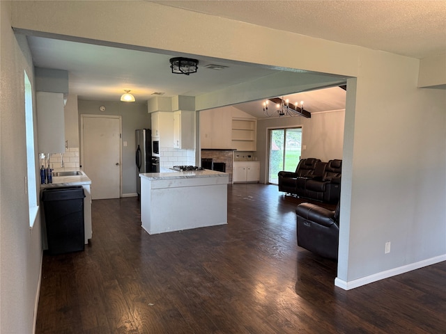 kitchen with black dishwasher, tasteful backsplash, white cabinetry, and dark hardwood / wood-style floors