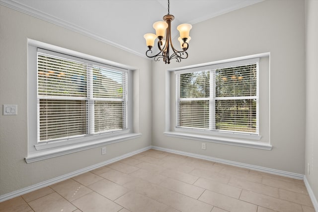 tiled spare room featuring a notable chandelier, ornamental molding, and a wealth of natural light