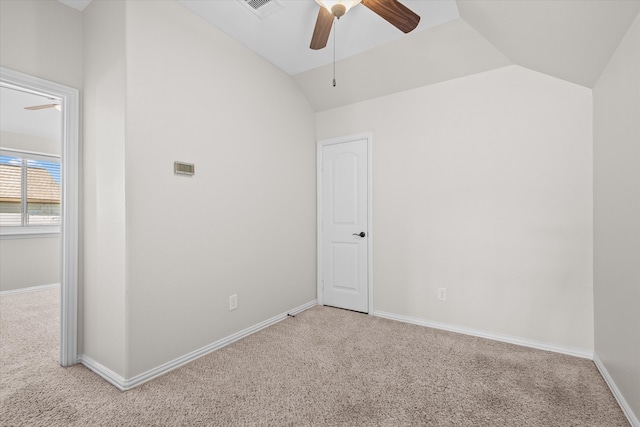 spare room featuring ceiling fan, lofted ceiling, and carpet floors