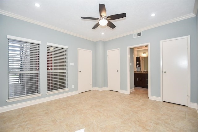 unfurnished bedroom with ceiling fan, light tile patterned flooring, ornamental molding, and connected bathroom