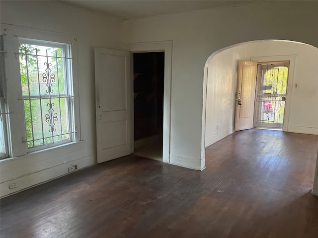 spare room featuring dark hardwood / wood-style flooring