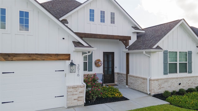 modern inspired farmhouse with a garage