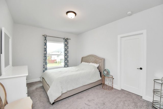 bedroom with light carpet