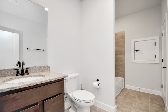 bathroom featuring tile patterned flooring, vanity, and toilet