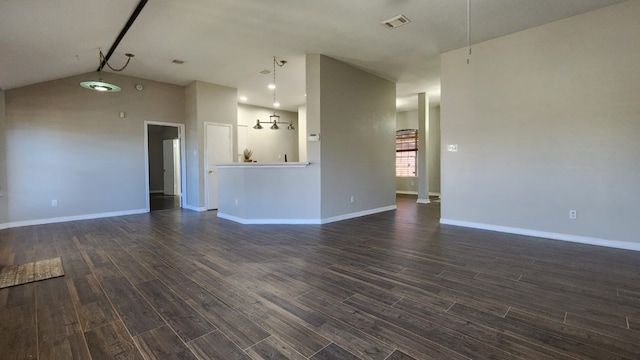 unfurnished living room with dark hardwood / wood-style flooring and lofted ceiling