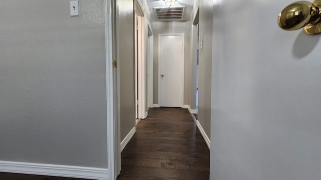 hall with dark hardwood / wood-style flooring