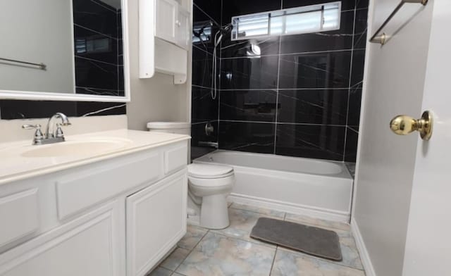 full bathroom featuring vanity, toilet, and tiled shower / bath