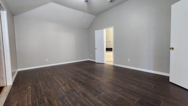 unfurnished room with dark hardwood / wood-style floors and lofted ceiling