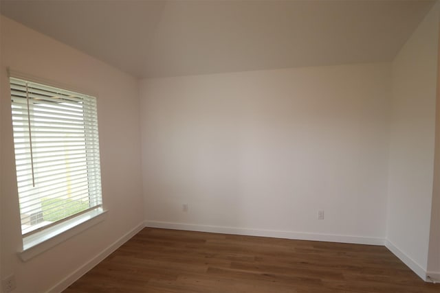 spare room with dark wood-type flooring