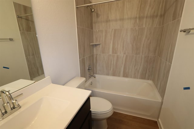 full bathroom featuring shower / bathtub combination, toilet, vanity, and hardwood / wood-style flooring