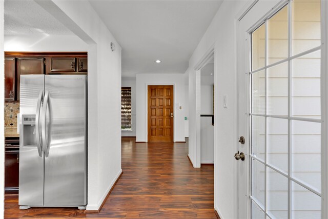 hallway featuring dark hardwood / wood-style flooring