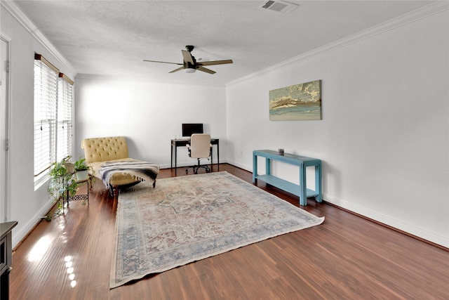 sitting room featuring ceiling fan, a healthy amount of sunlight, and wood-type flooring