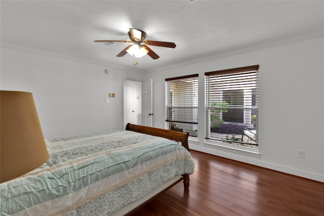 bedroom with a textured ceiling, ceiling fan, dark hardwood / wood-style flooring, and crown molding