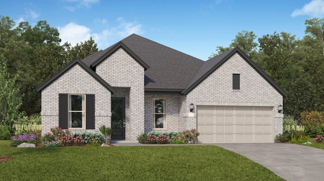 view of front of home featuring a garage and a front lawn