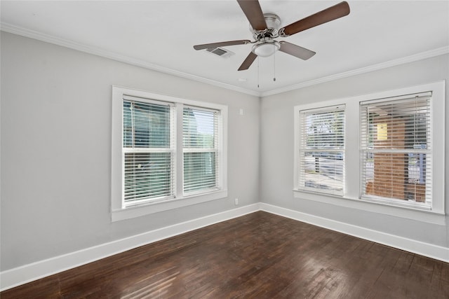 empty room with a wealth of natural light, ceiling fan, and hardwood / wood-style flooring