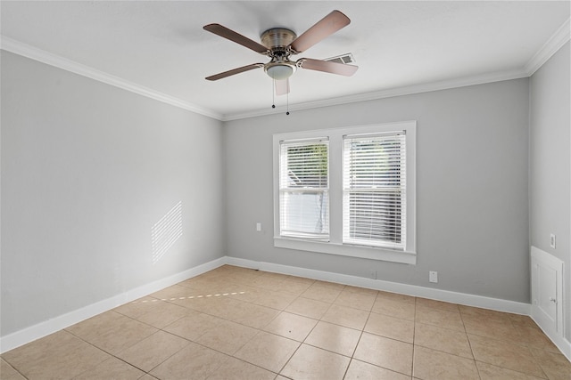 tiled spare room with ceiling fan and crown molding