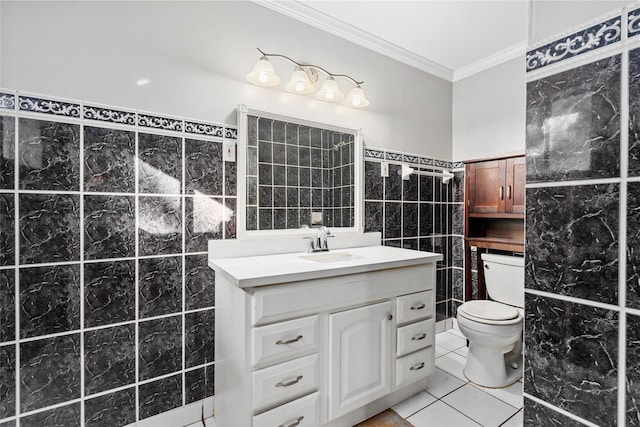 bathroom featuring tile patterned floors, ornamental molding, vanity, tile walls, and toilet