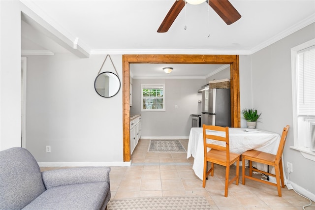 tiled dining room featuring ceiling fan and ornamental molding