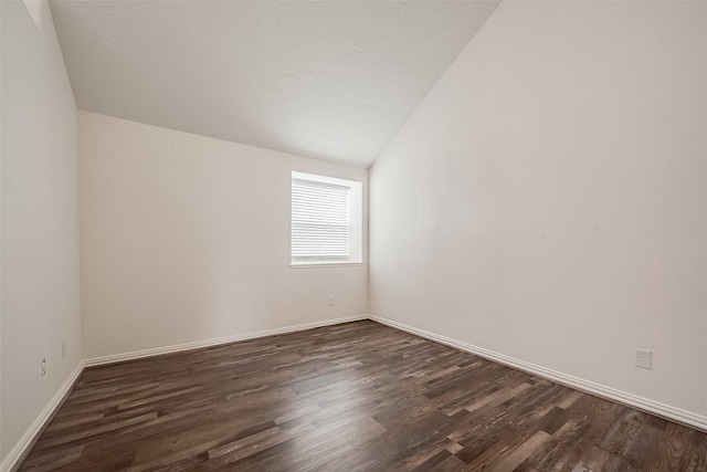 unfurnished room with a textured ceiling and dark wood-type flooring