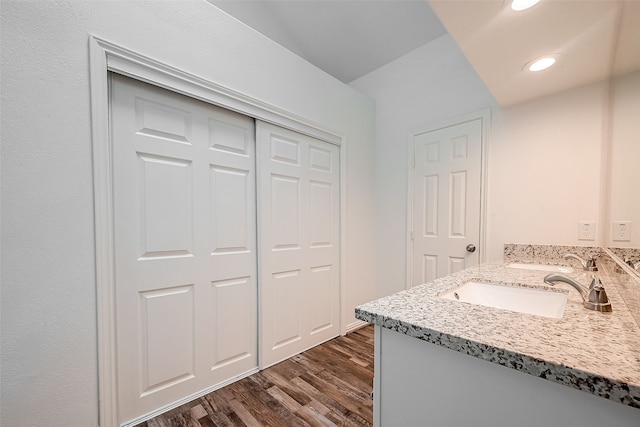 bathroom featuring vanity and hardwood / wood-style flooring