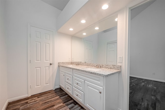 bathroom featuring wood-type flooring and vanity