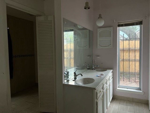 bathroom with a wealth of natural light and vanity