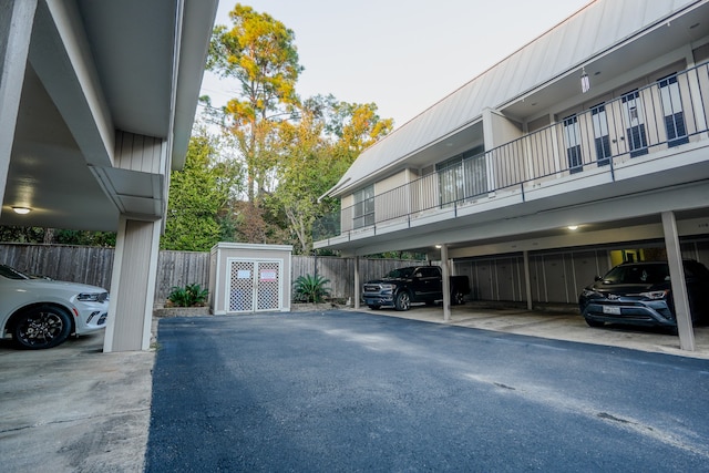 view of parking / parking lot featuring a carport