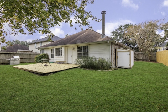 back of house with a lawn and a wooden deck