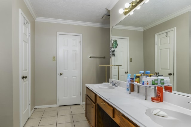 bathroom featuring vanity, a textured ceiling, tile patterned floors, and crown molding