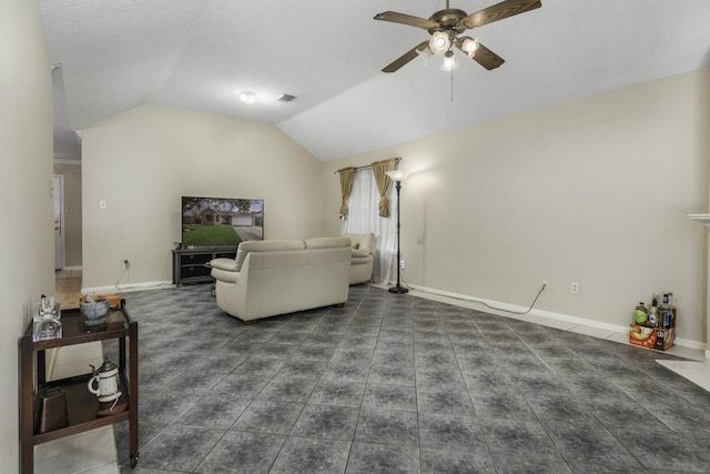 tiled living room featuring ceiling fan and lofted ceiling