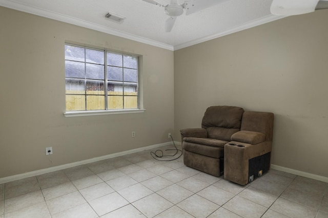 unfurnished room with ceiling fan, crown molding, and light tile patterned floors