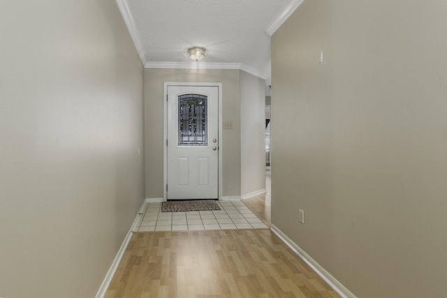 doorway to outside featuring light hardwood / wood-style floors and crown molding