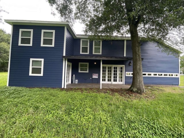 rear view of house featuring french doors